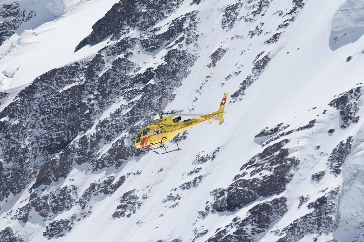 Helicopter Over Alpine Snow